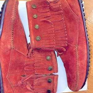 Never worn! Minnetonka fringe moccasin booties with gold embellishments.